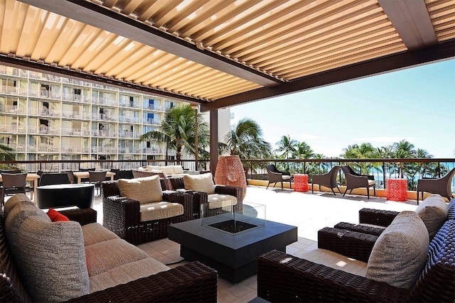 view of patio / terrace with an outdoor living space with a fire pit