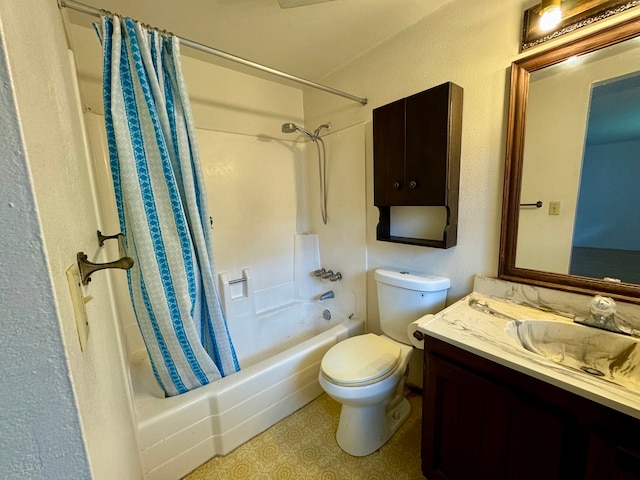 full bathroom featuring shower / bath combo, vanity, and toilet