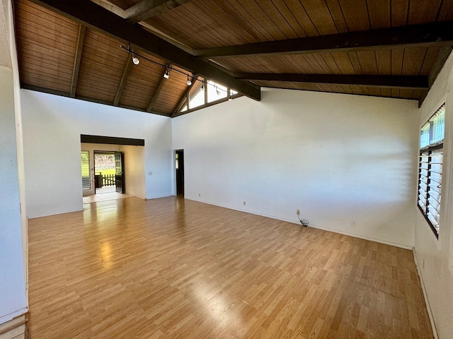 spare room featuring light wood-type flooring, wood ceiling, beam ceiling, and high vaulted ceiling