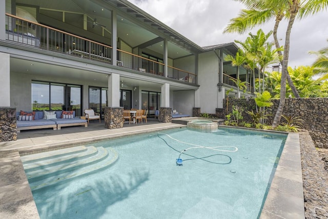 view of pool featuring a patio area and a pool with connected hot tub