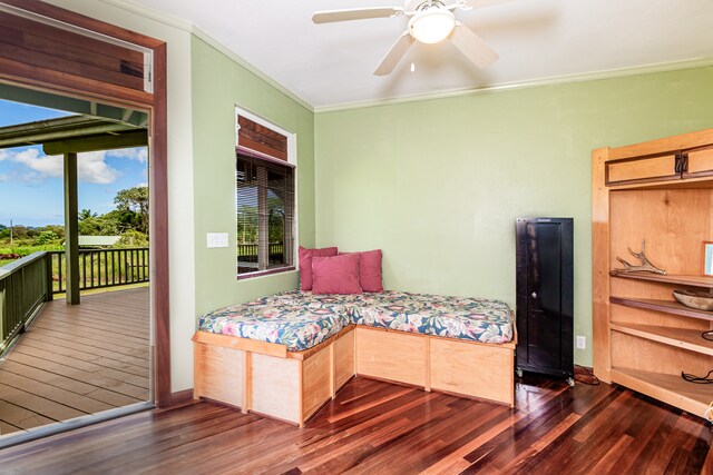 bedroom featuring dark wood-type flooring, ceiling fan, ornamental molding, and access to exterior