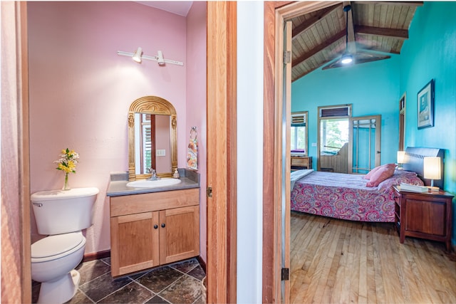 bathroom featuring vaulted ceiling with beams, wood ceiling, hardwood / wood-style floors, toilet, and vanity