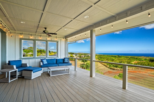 wooden terrace featuring an outdoor living space and ceiling fan