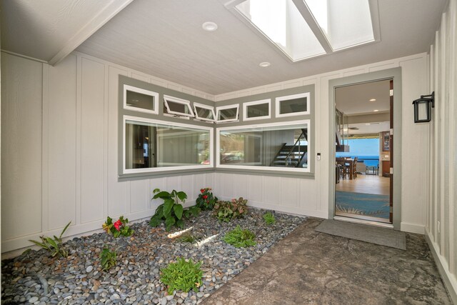 stairway with hardwood / wood-style floors and ceiling fan