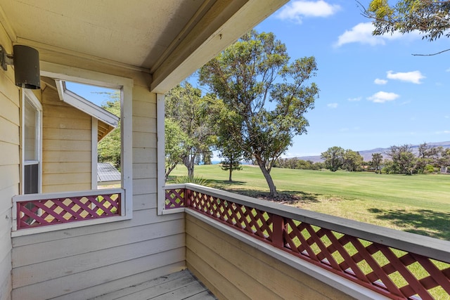 wooden deck with a yard