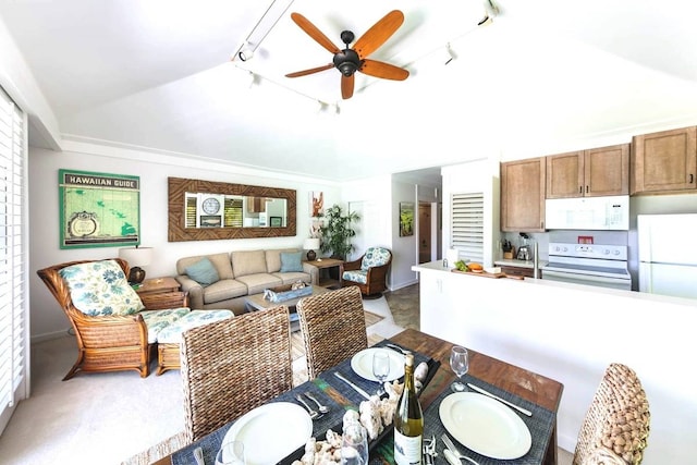 living room featuring vaulted ceiling, ceiling fan, and track lighting