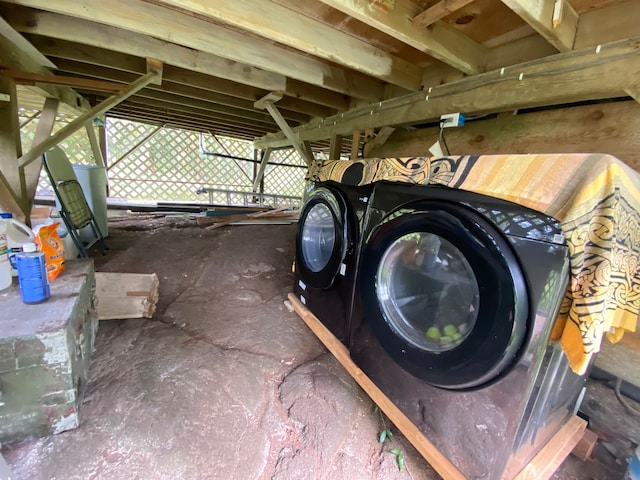 exterior space featuring concrete flooring and washer and dryer