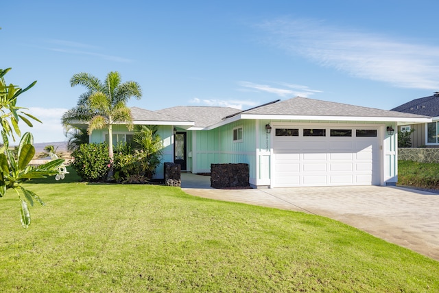 ranch-style house with a garage and a front lawn