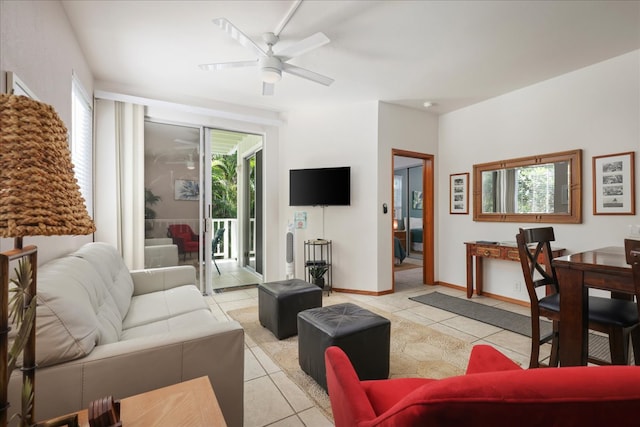 living room featuring ceiling fan and light tile patterned flooring