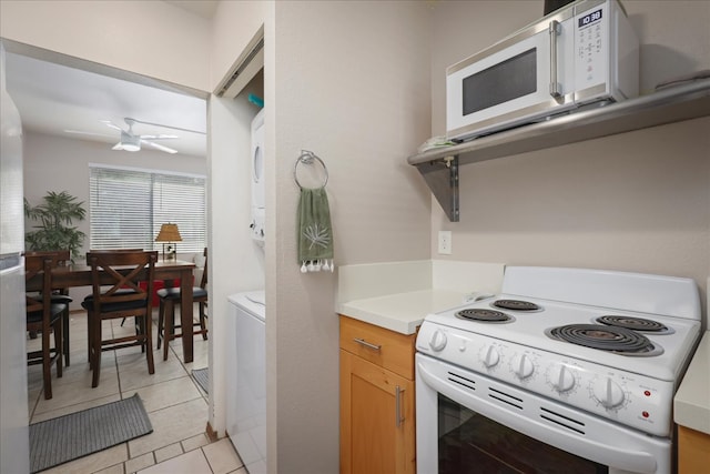 kitchen featuring white appliances, light tile patterned floors, and ceiling fan