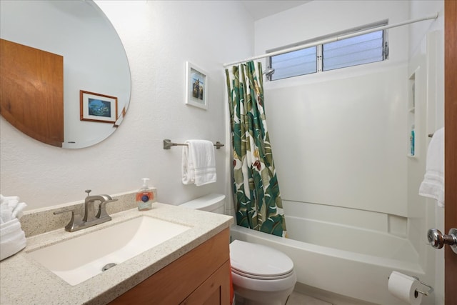 full bathroom with vanity, toilet, and shower / tub combo with curtain