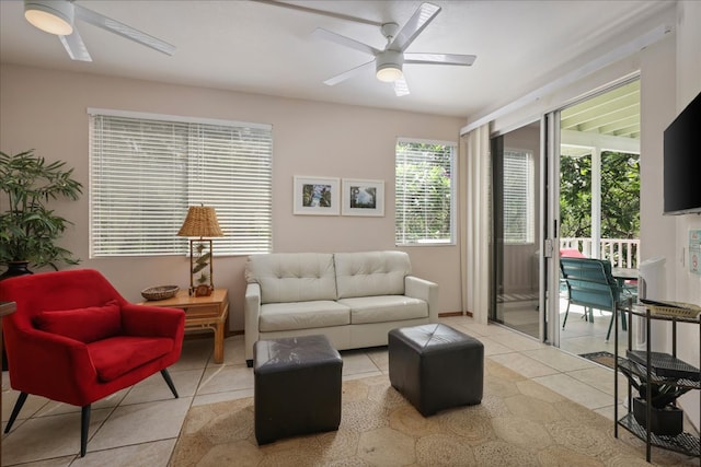 tiled living room with ceiling fan