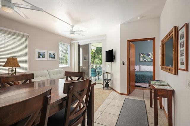 tiled dining room featuring ceiling fan