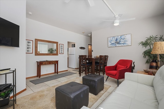 tiled living room featuring ceiling fan