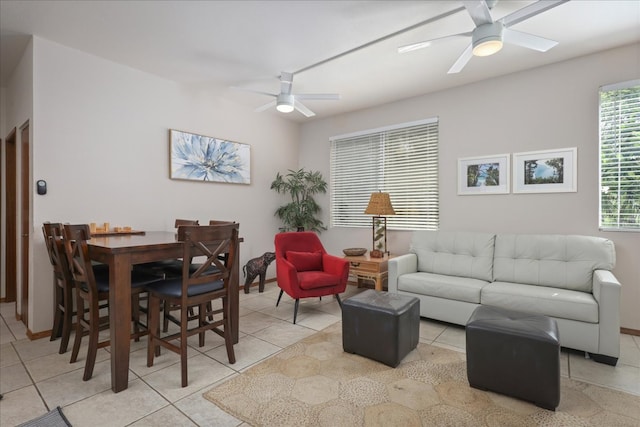 living room featuring ceiling fan and light tile patterned floors