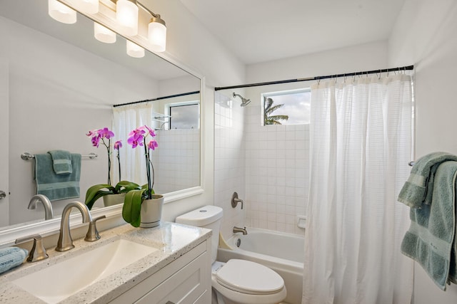 full bathroom featuring vanity, toilet, and shower / bathtub combination with curtain