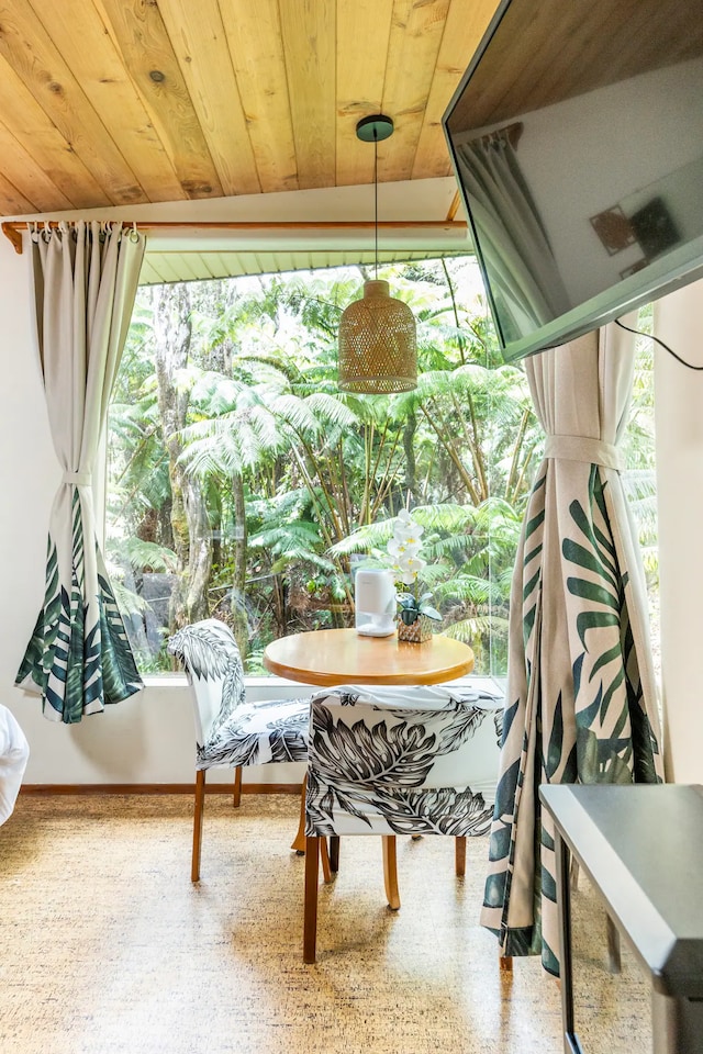 sunroom / solarium featuring wooden ceiling