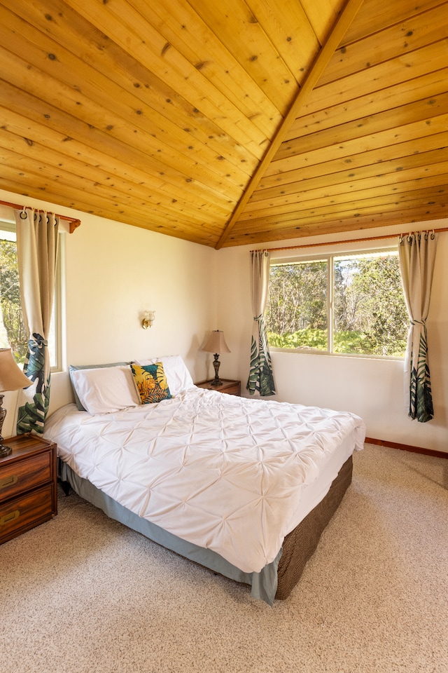 bedroom with carpet, wooden ceiling, and vaulted ceiling