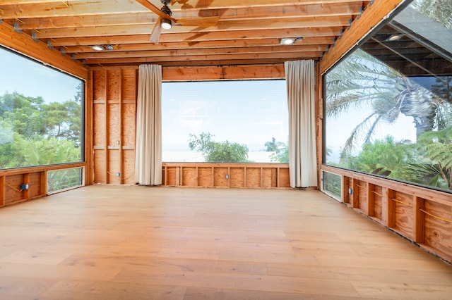 unfurnished sunroom featuring a wealth of natural light