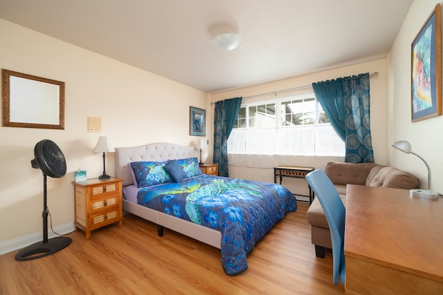 bedroom with hardwood / wood-style floors