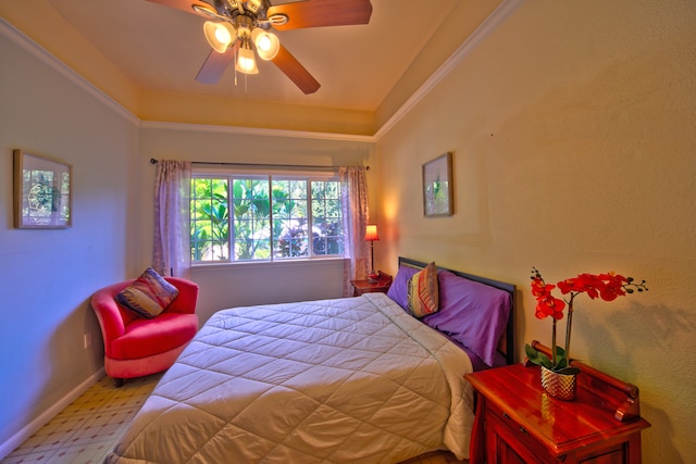 bedroom with ornamental molding and ceiling fan