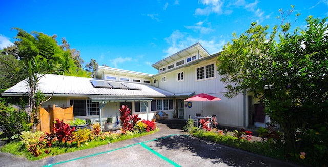 view of front of house featuring solar panels