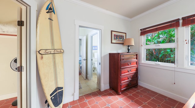 interior space featuring tile patterned floors, a wealth of natural light, and ornamental molding