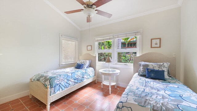 bedroom with crown molding, vaulted ceiling, ceiling fan, and tile patterned floors