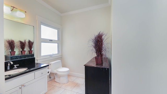 bathroom featuring vanity, toilet, ornamental molding, and tile patterned floors