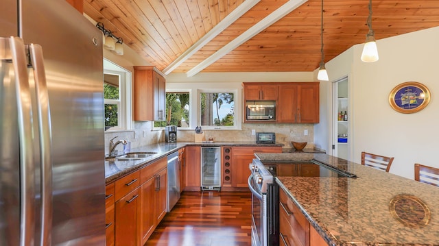 kitchen with appliances with stainless steel finishes, wood ceiling, sink, dark stone counters, and beverage cooler