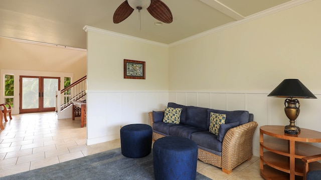 tiled living room with crown molding and ceiling fan