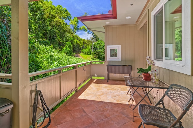 view of patio featuring a balcony