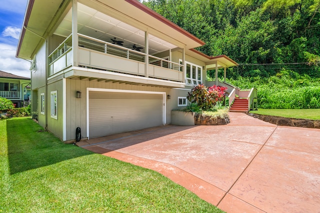 view of front of property with a garage and a front yard