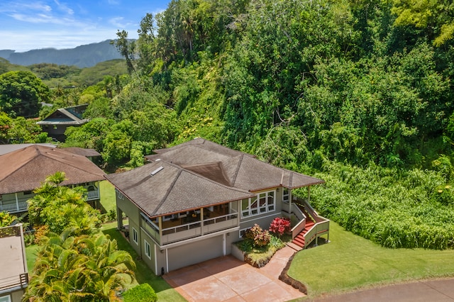 birds eye view of property featuring a mountain view