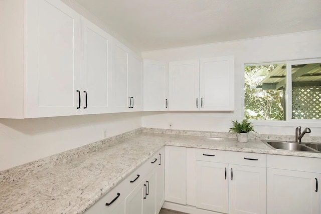 kitchen with white cabinets and sink