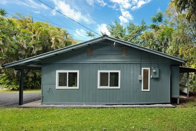 view of side of property featuring a yard