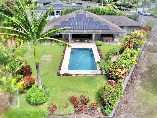 view of pool featuring a yard and a patio