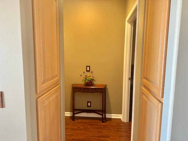 corridor with dark hardwood / wood-style floors