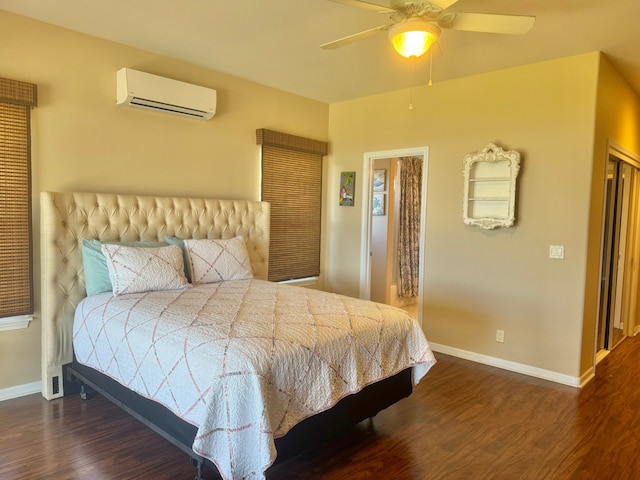 bedroom featuring ceiling fan, dark wood-type flooring, and a wall mounted air conditioner