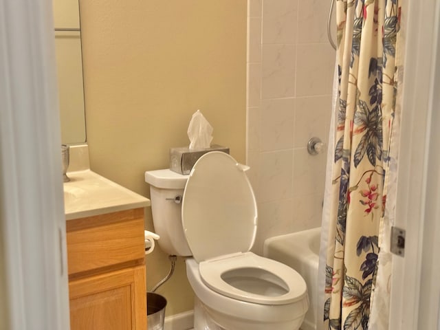 full bathroom with vanity, shower / bath combo, and toilet