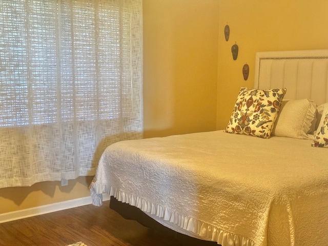 bedroom featuring wood-type flooring