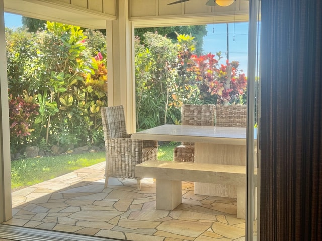 doorway to outside with ceiling fan