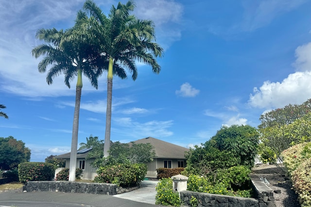 view of property hidden behind natural elements