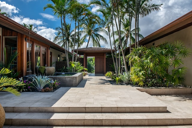 doorway to property featuring a patio