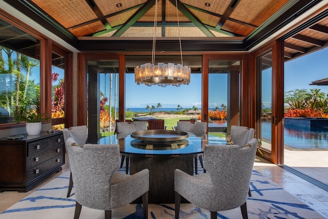 sunroom / solarium with wood ceiling, a notable chandelier, and vaulted ceiling with beams