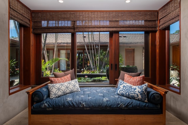 sunroom / solarium featuring a healthy amount of sunlight