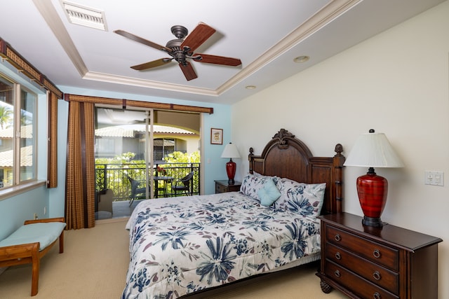 bedroom featuring a raised ceiling, access to exterior, light colored carpet, and ceiling fan