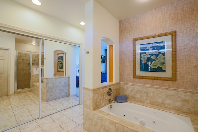 bathroom featuring plus walk in shower and tile patterned flooring