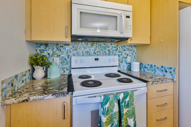 kitchen featuring white appliances, light brown cabinetry, and tasteful backsplash