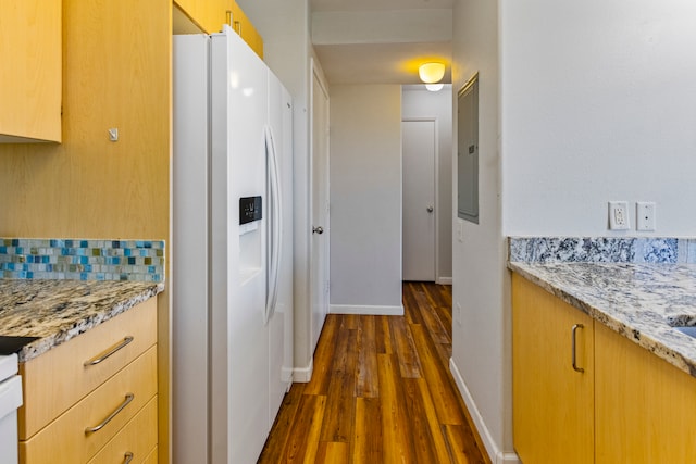 kitchen with white refrigerator with ice dispenser, electric panel, light brown cabinetry, light stone countertops, and dark wood-type flooring